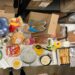 plates of different dishes on the table of potluck party